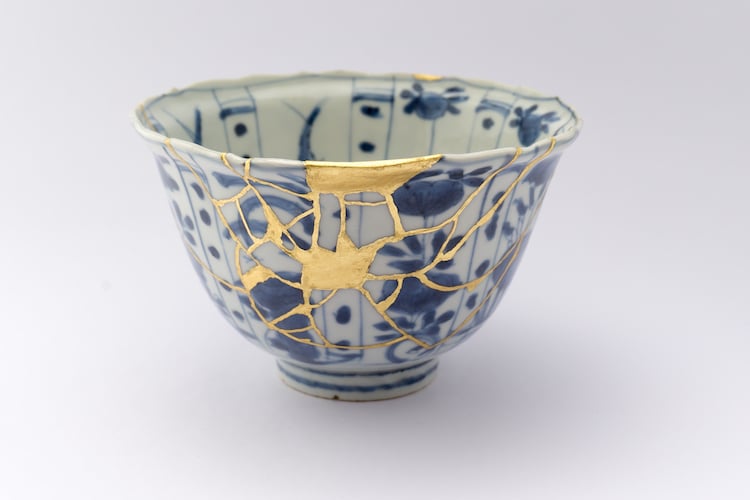 Kintsugi bowl with gold-repaired cracks